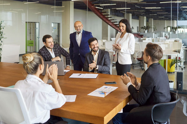 A group of employees in a meeting