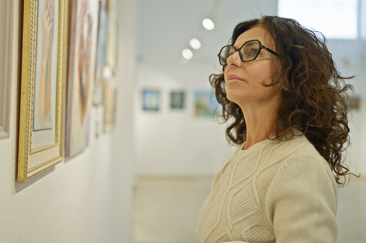Woman looking at artwork